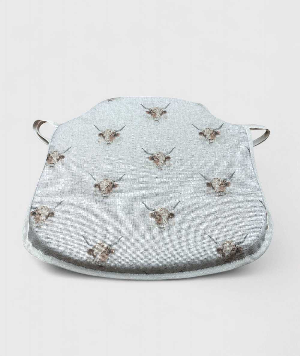 Spindle shaped seat pads with a Highland cattle print