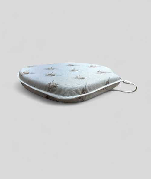 Spindle shaped seat pads in beige linen type fabric with a highland cow print