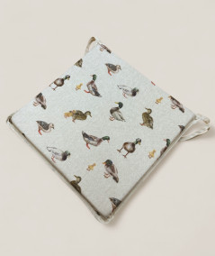Square shaped non-slip chair cushions in beige with a modern duck design