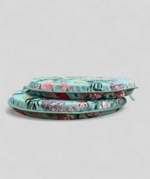 Luxury round aqua coloured velvet bistro seat cushions with a multicoloured floral print