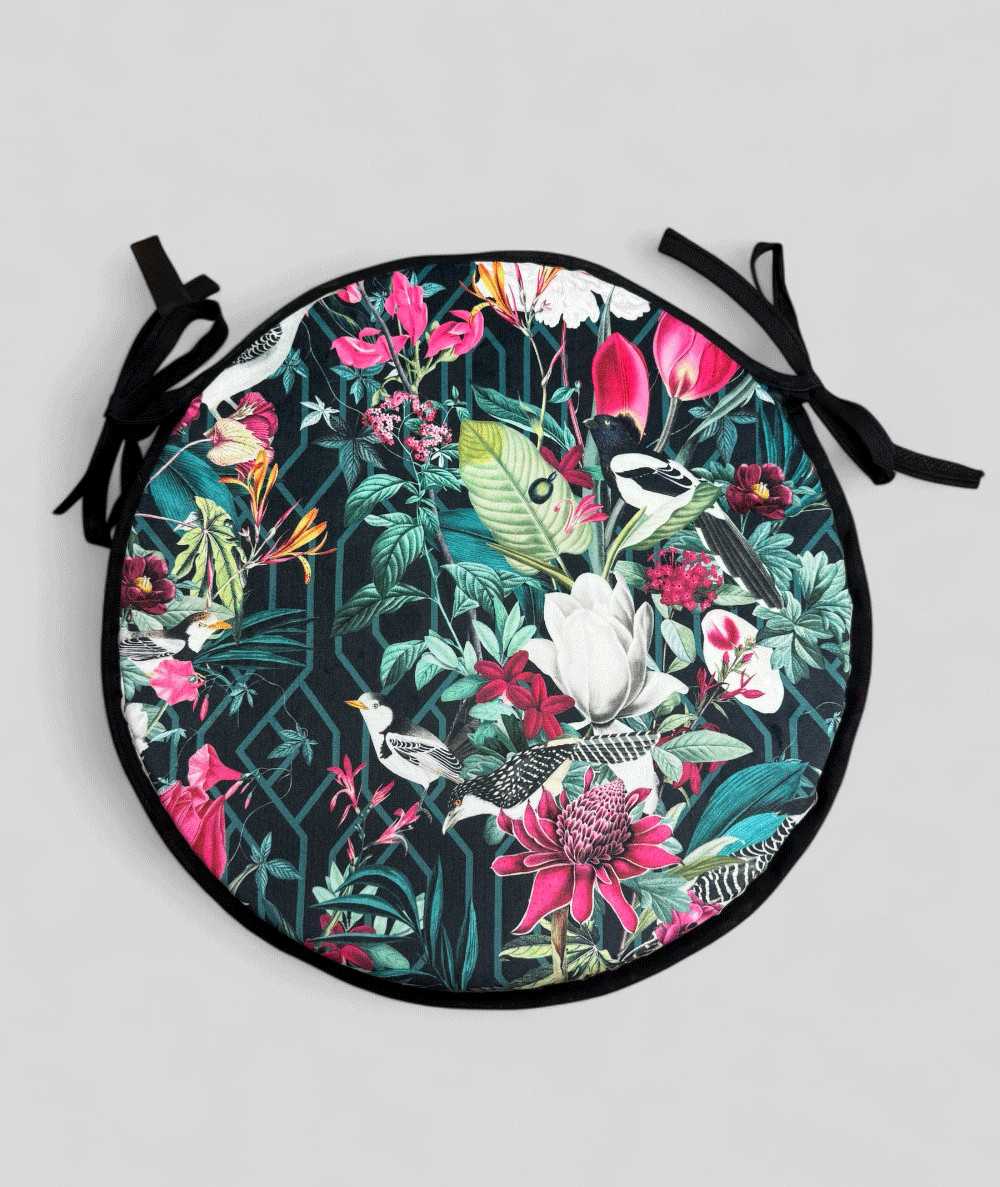 Luxury round black coloured velvet bistro seat pads with a multicoloured tropical print