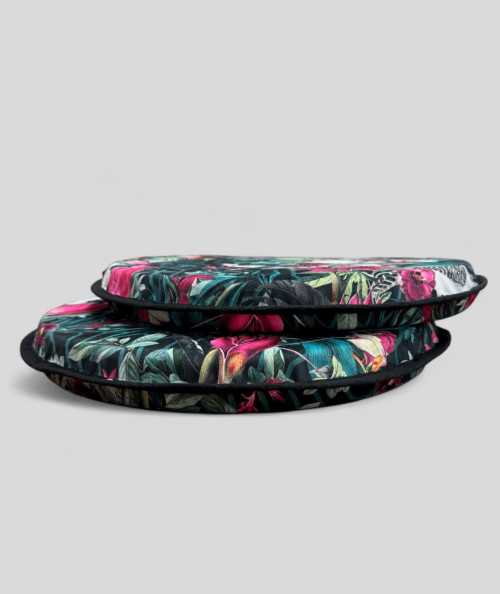 Luxury round black coloured velvet bistro seat cushions with a multicoloured tropical print