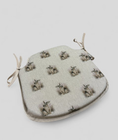 Beige spindle shaped non-slip chair pads with a small rabbit design