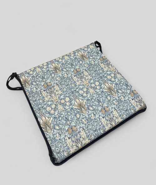 Blue patterned square shaped chair cushions
