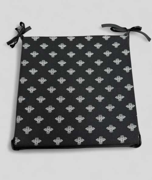Square shaped black seat pads with a small bee metallic print