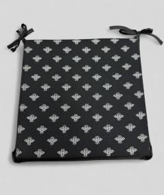 Square shaped black seat pads with a small bee metallic print