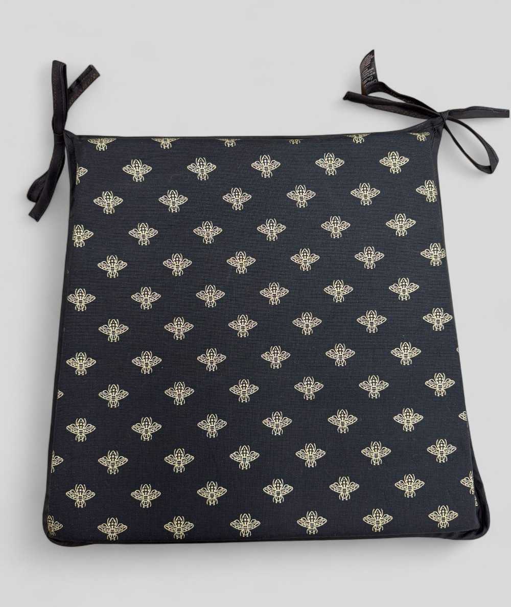 Black tapered seat pads with an all over small gold bee print