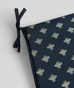 Black tapered chair pads with an all over small gold bee print