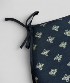 Black classic D shaped chair pads with an all over small gold bee print