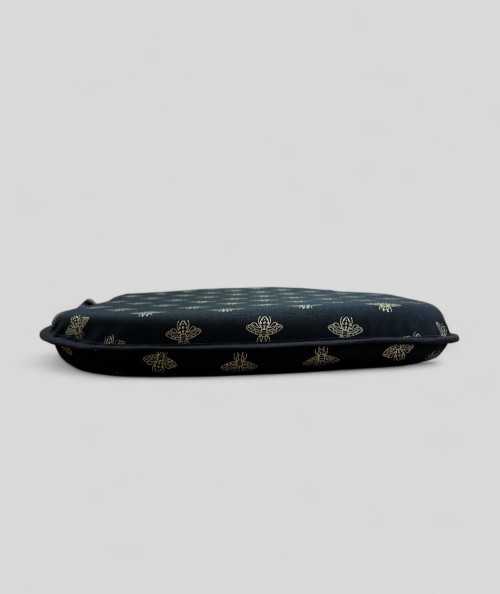 Black spindle shaped seat cushions with an all over small gold bee print