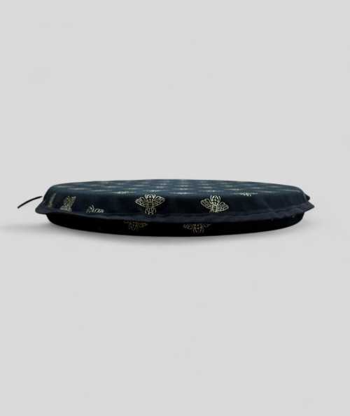 Black circular bistro seat cushions with an all over small gold bee print