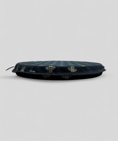 Black circular bistro seat cushions with an all over small gold bee print