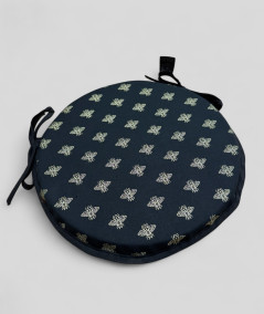 Black circular bistro chair cushions with an all over small gold bee print