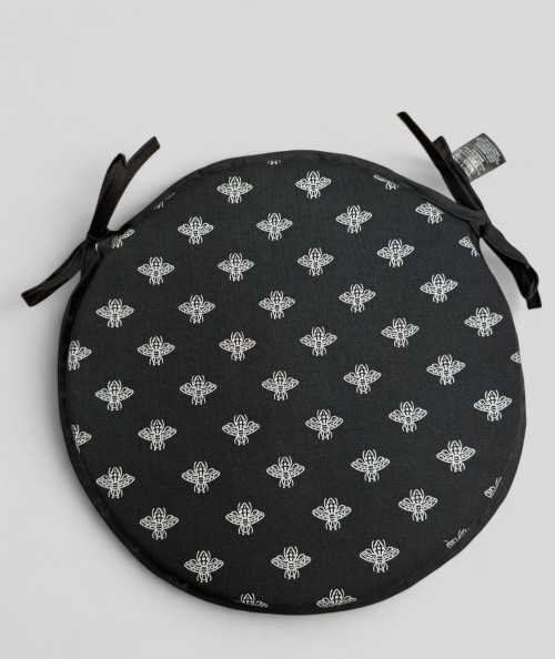Round black seat pads with an all over small silver bee design