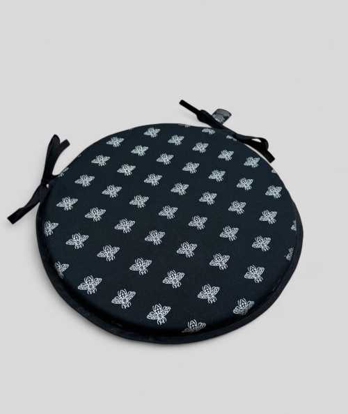 Round black chair cushions with an all over small silver bee design