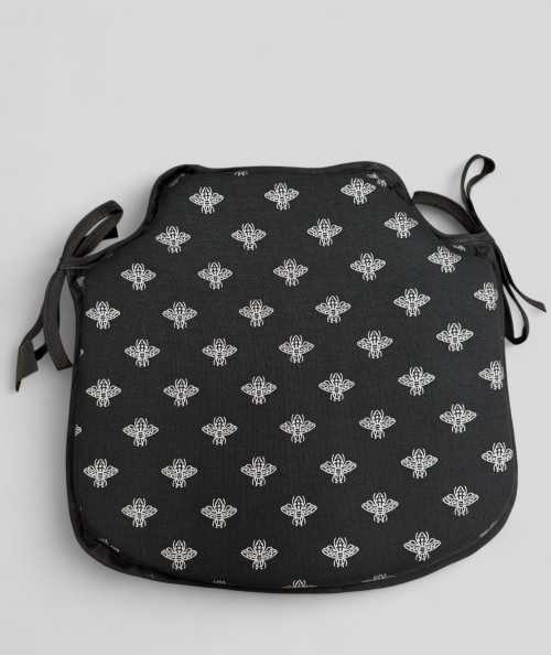 Black spindle shaped seat pads with a small silver bee design