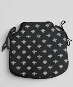 Black spindle shaped seat pads with a small silver bee design