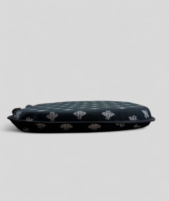 Black spindle shaped seat cushions with a small silver bee design