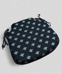 Black spindle shaped chair cushions with a small silver bee design