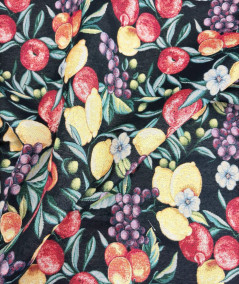 Black tapestry fabric with a multi-coloured fruit design
