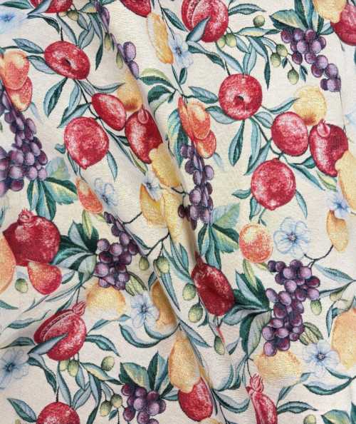 Natural coloured tapestry fabric with a multi-coloured fruit design
