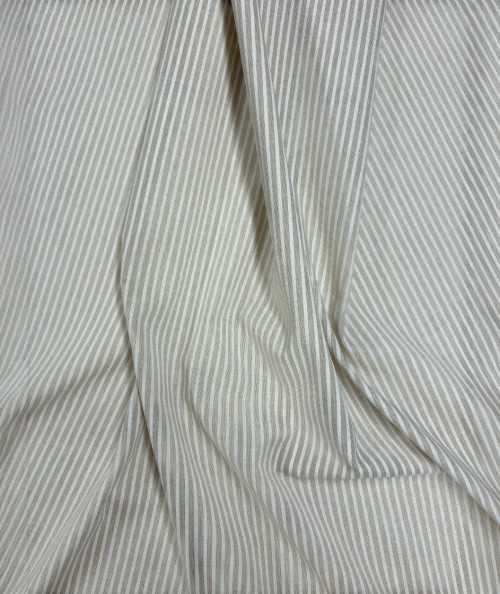 White and beige thinly striped fabric