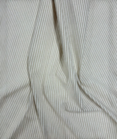 White and beige thinly striped fabric