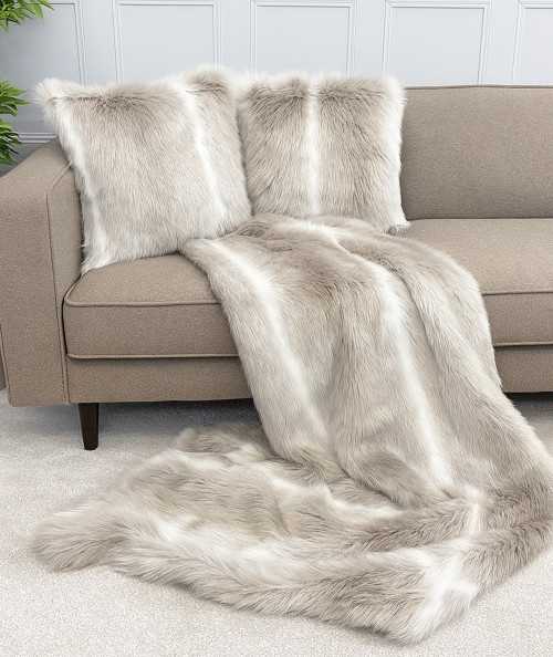 Reindeer faux fur throw and cushions